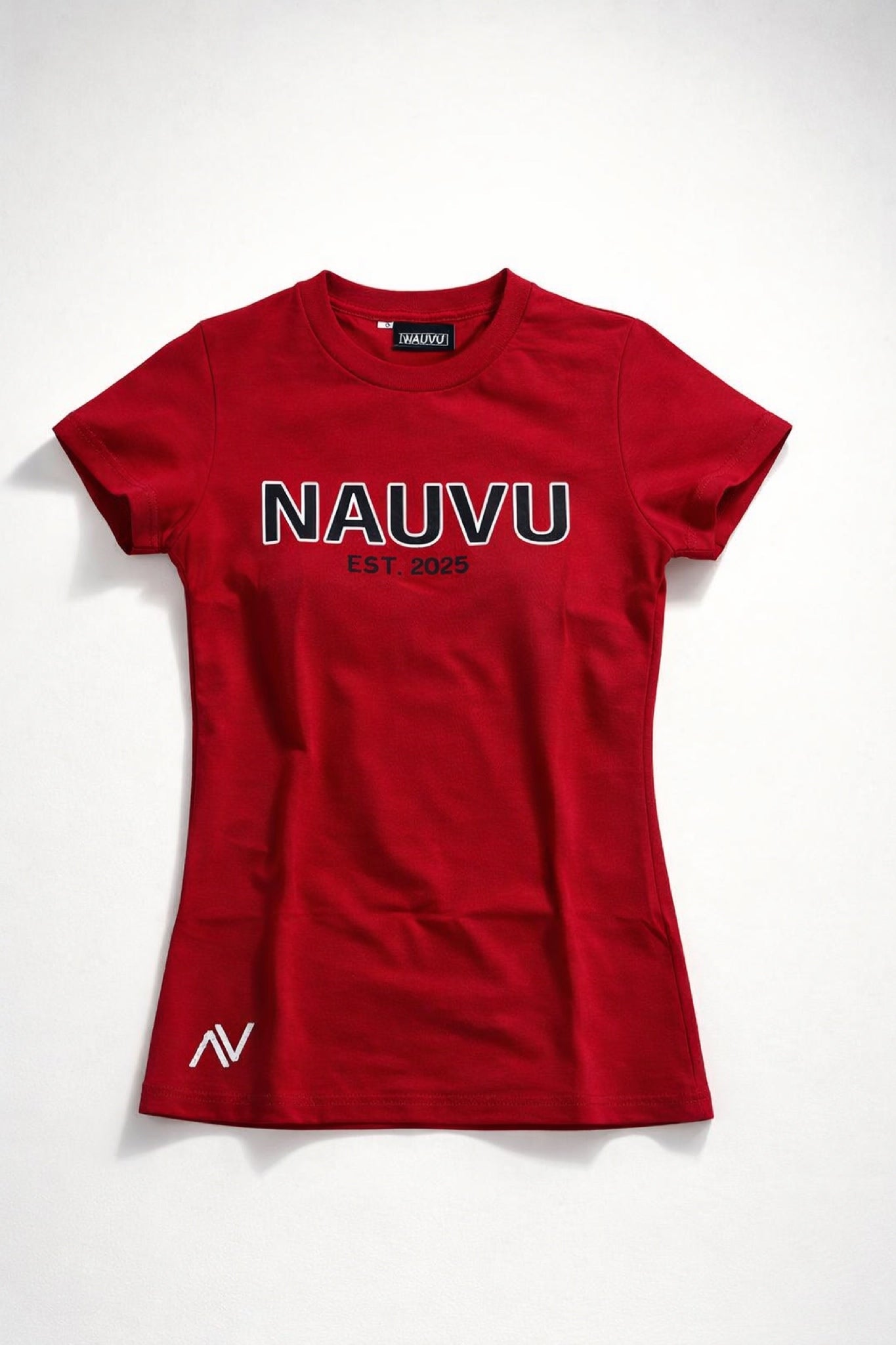  Close-up of embroidered logo above hem on Nauvu cotton jersey graphic t-shirt