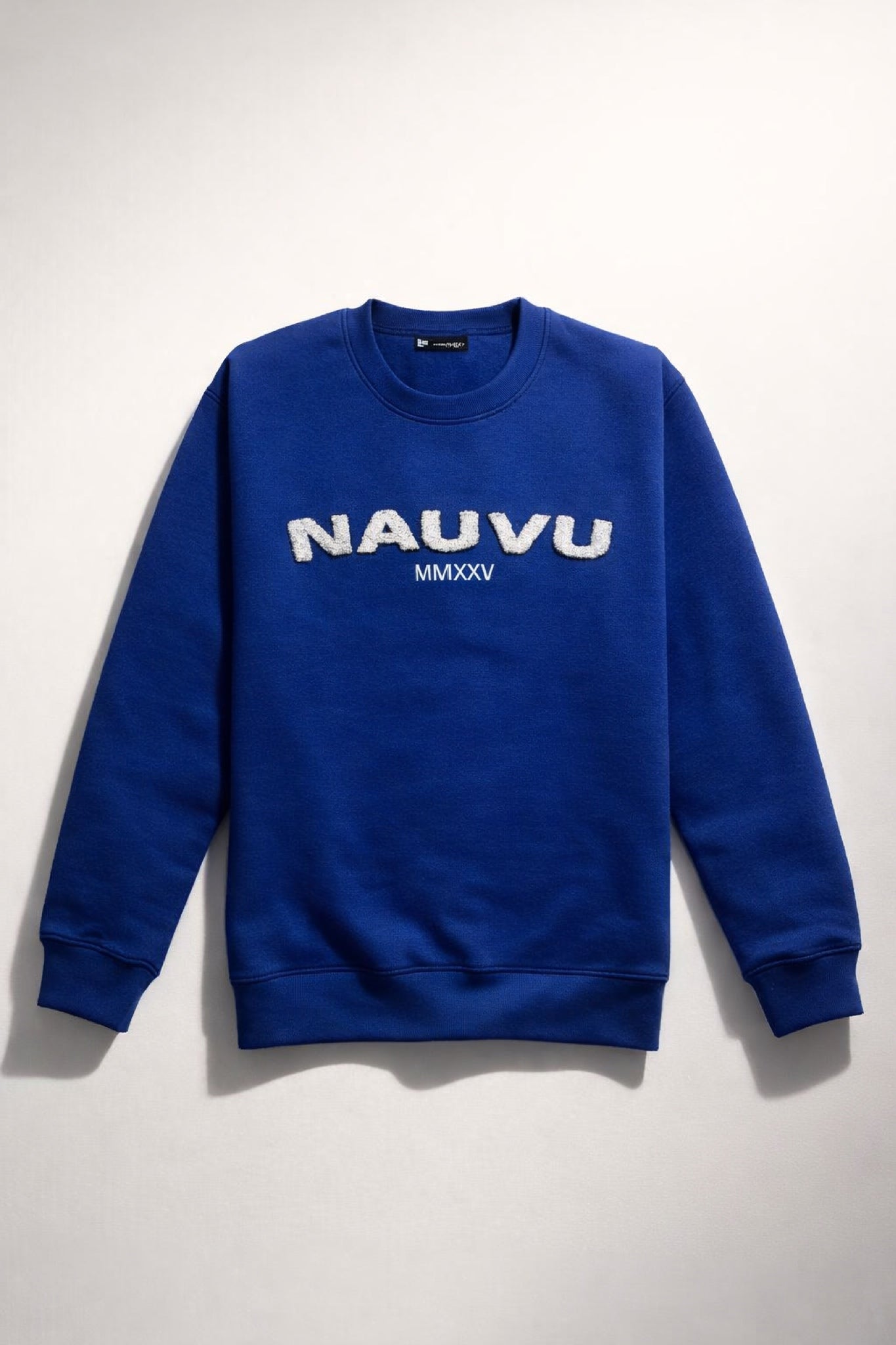Detail of chenille patch on men’s varsity fleece sweatshirt
